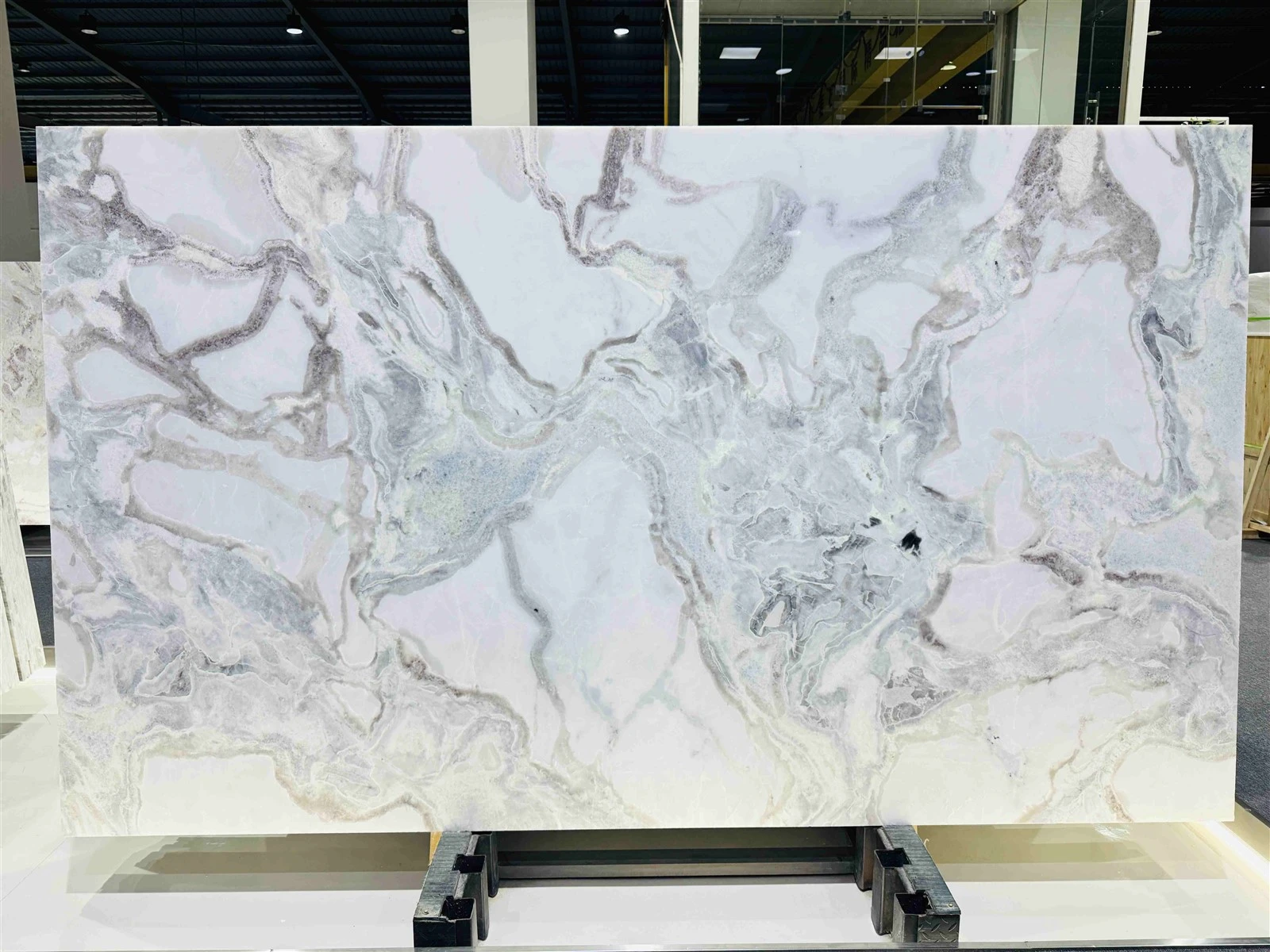 Oyster White Marble slab with a creamy white background and flowing grey, taupe and subtle blush veining Oyster White Marble slab with a creamy white background and flowing grey, taupe and subtle blush veining